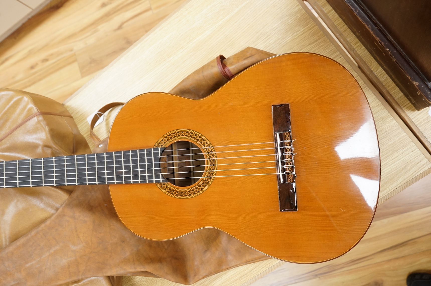 A Spanish Manuel Contreras classical guitar, with cedar front, Indian rosewood back sides and ebony fingerboard, with makers label inside body; M.G. Contreras, Madrid, back 49cm